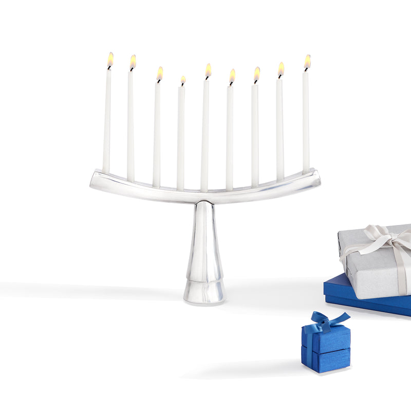 Nambe Judaica nine-candle menorah with polished metal base and curved arms