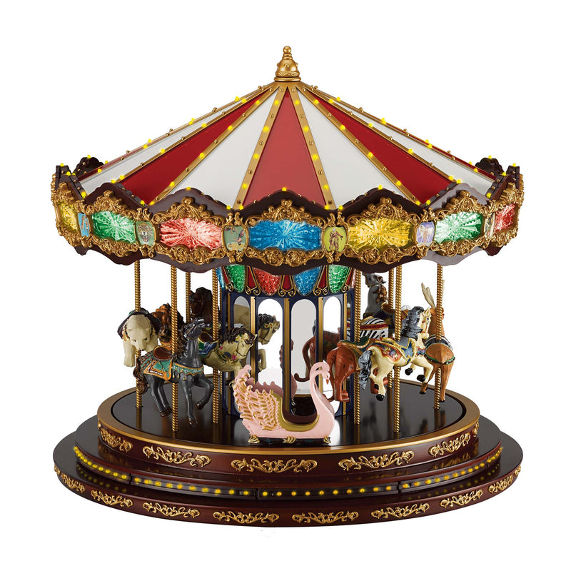Decorative Christmas marquee carousel with red-and-gold tent and carousel horses