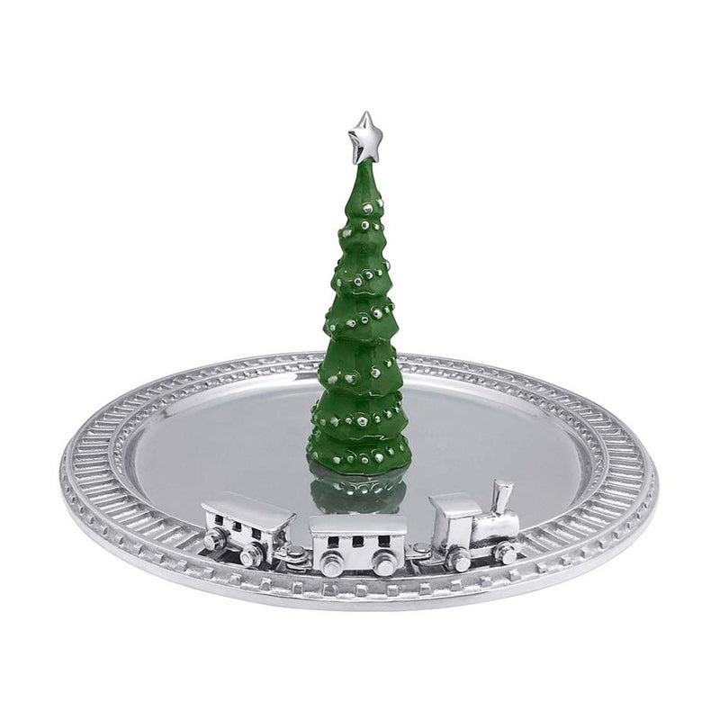 Green enamel Christmas tree centerpiece with star topper and small train on silver platter