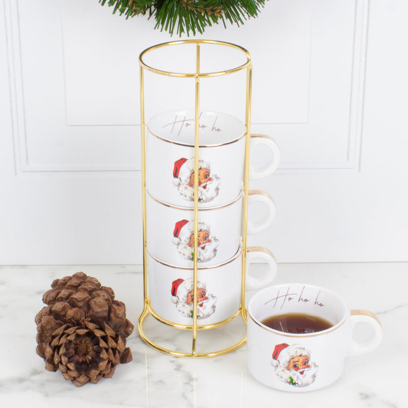 Set of 4 Santa mugs with white cups, red Santa prints, on gold metal tower stand