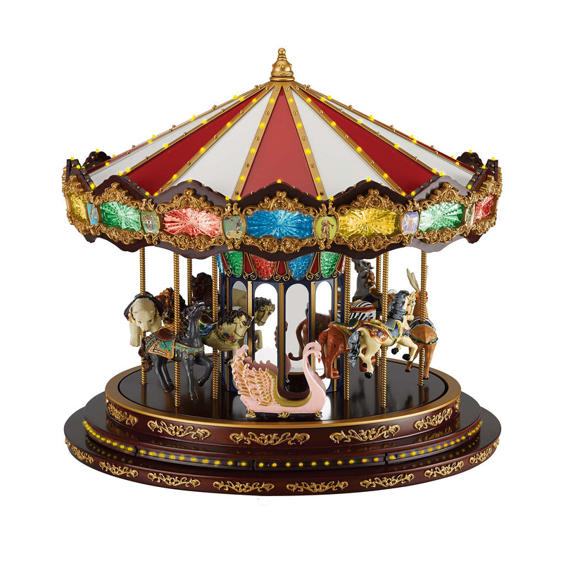 Decorative Christmas carousel with gold trim, red white canopy, and dancing animals lights