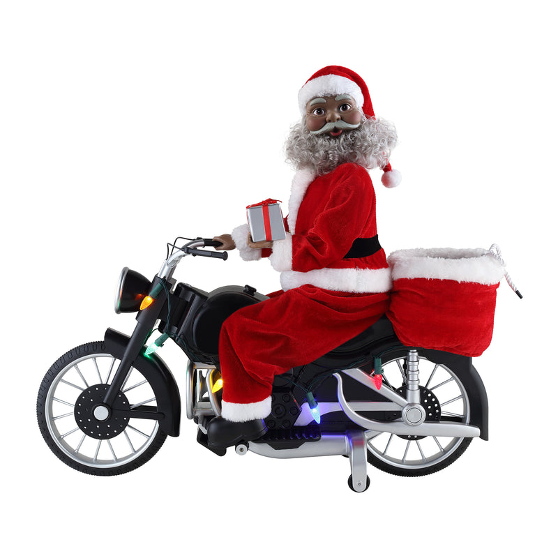 Motorcycling Santa figurine on black motorcycle holding a gift, red suit with white trim