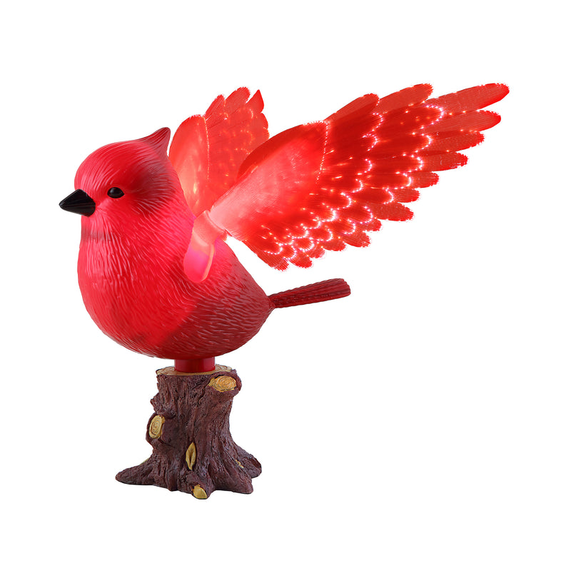 Animated red cardinal tree topper with spread wings on textured branch base