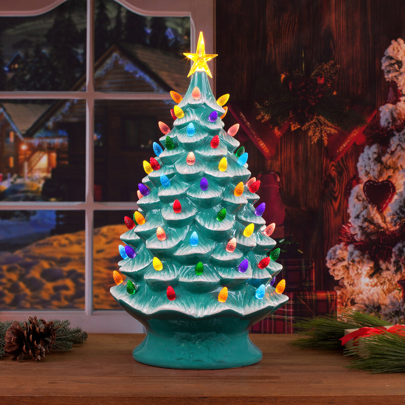 Teal ceramic Christmas tree figurine with multicolor lights and star topper