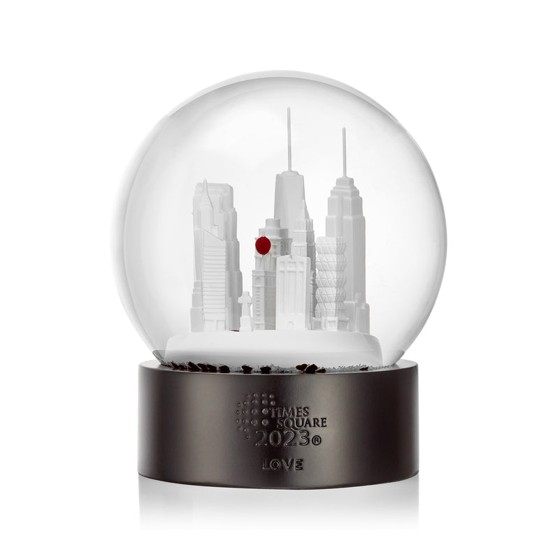 Crystal snow globe with white Times Square skyline and dark engraved base