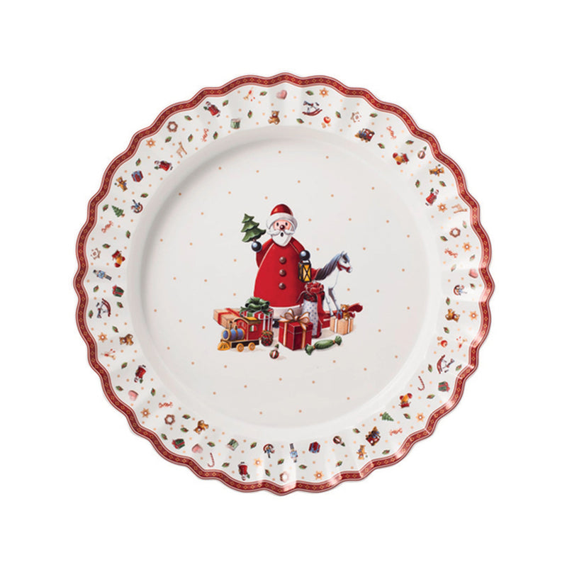 Round serving platter with white center, red scalloped rim, holiday toy maker illustration