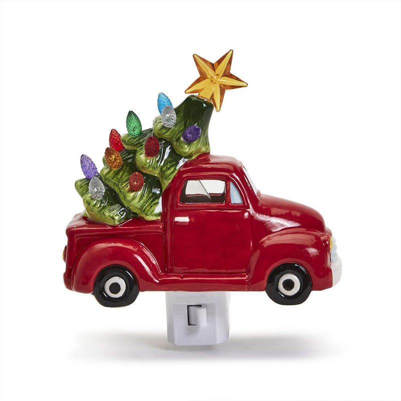 Red ceramic truck night light with green Christmas tree and star topper, plug base