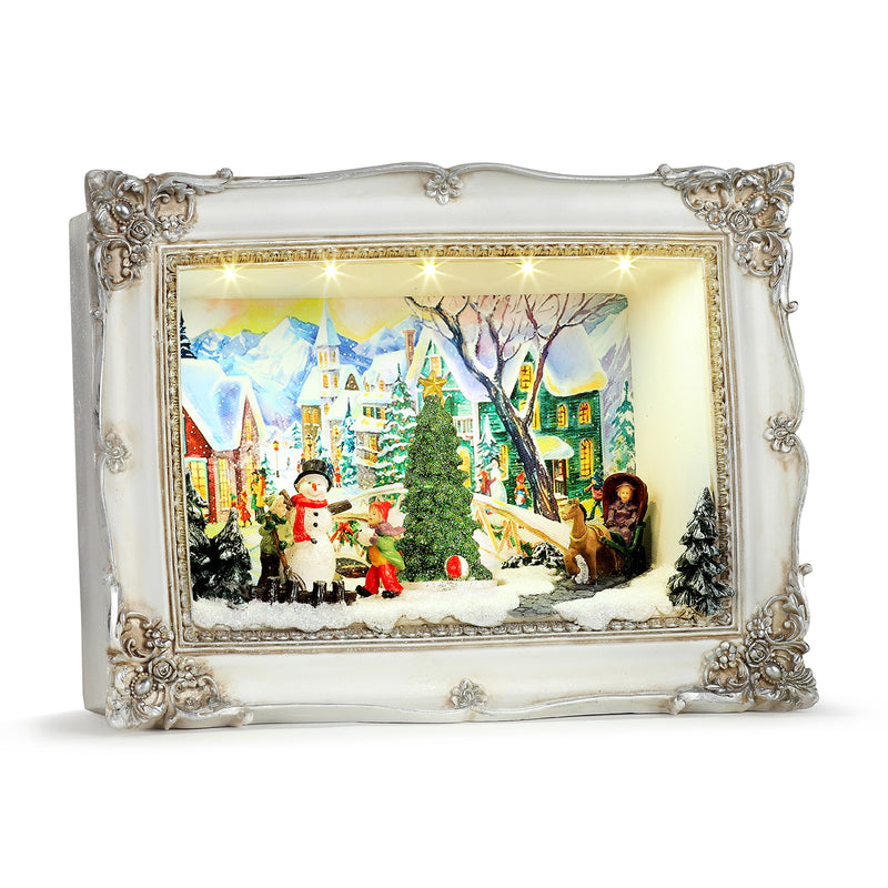 Animated village scene shadow box with ornate silver frame and lit snowy buildings