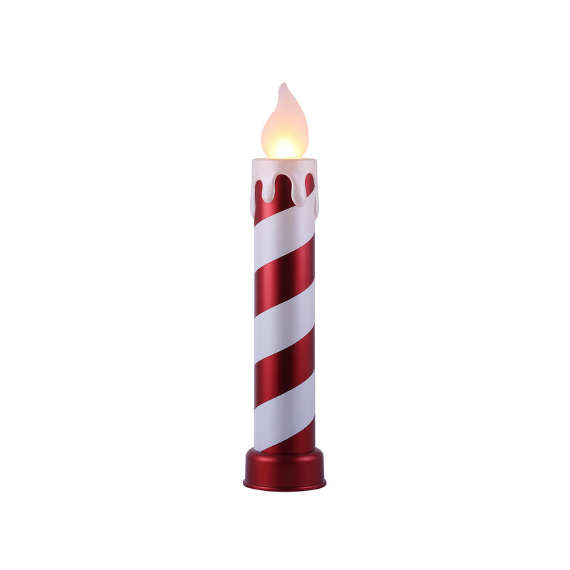 Red and white striped blow mold candle with lit flame