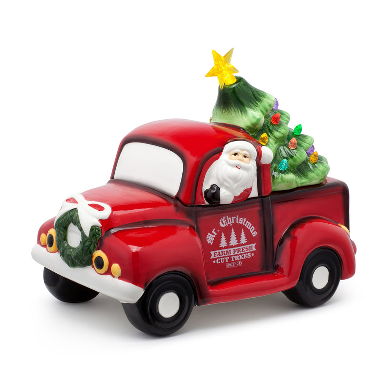 Red ceramic vintage truck cookie jar with Santa and small Christmas tree top