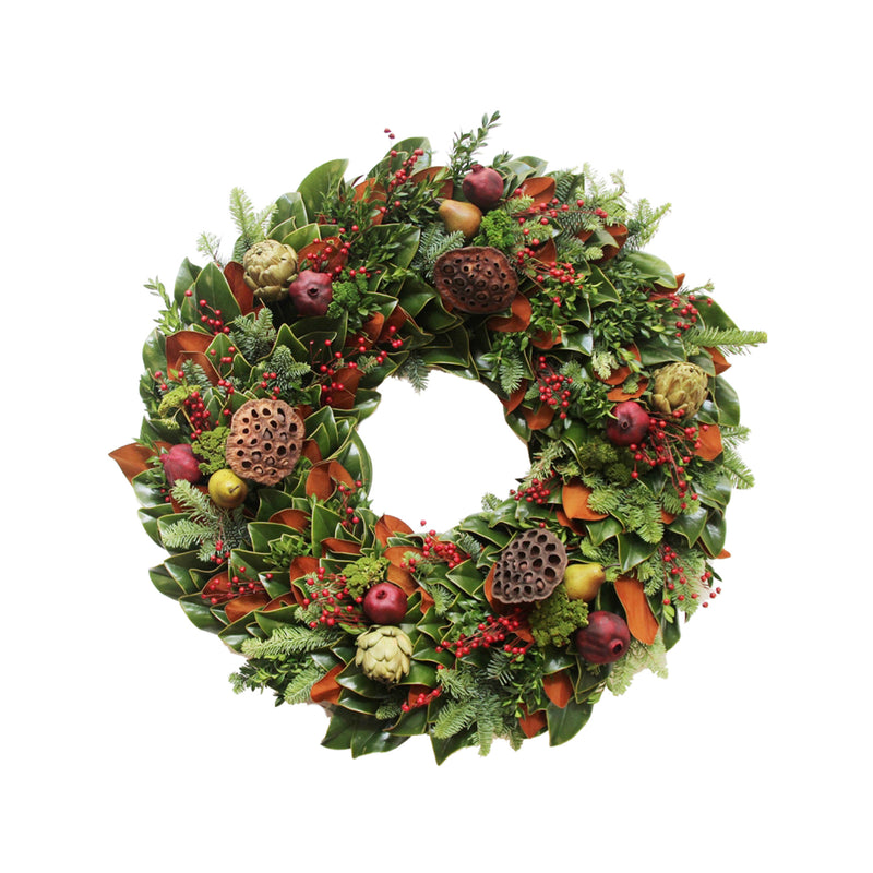 Decorative colonial wreath with green foliage, red berries, pinecones, and orange ribbon loops