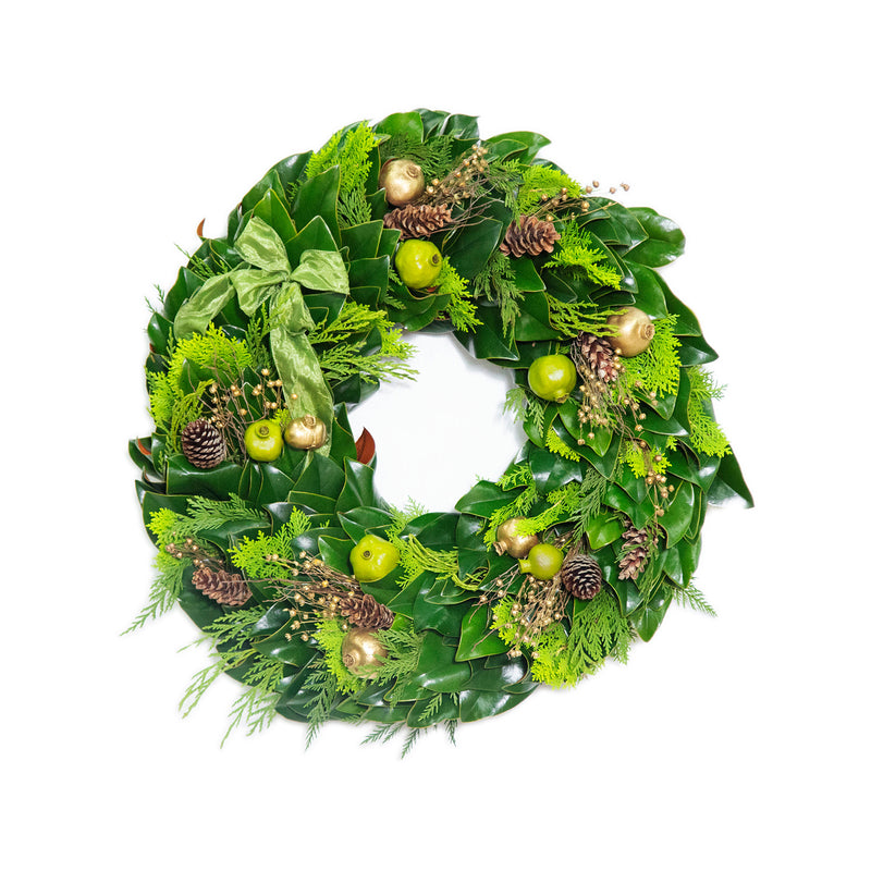 Fresh green wreath with cedar-like leaves, pinecones, and gold acorn ornaments