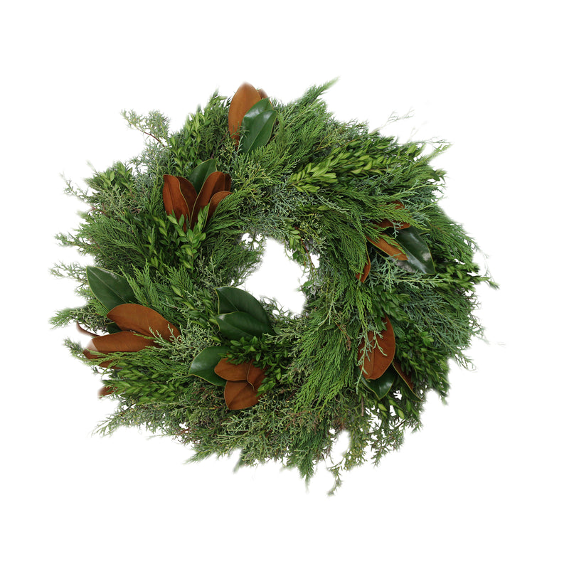 Green evergreen wreath with brown leaf bunch accents and full round shape