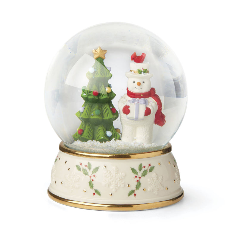 Lenox porcelain snow globe with snowman, Christmas tree, and gold holly base