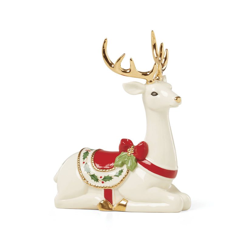 Lenox porcelain reindeer figurine, laying pose, white body with gold antlers and red saddle