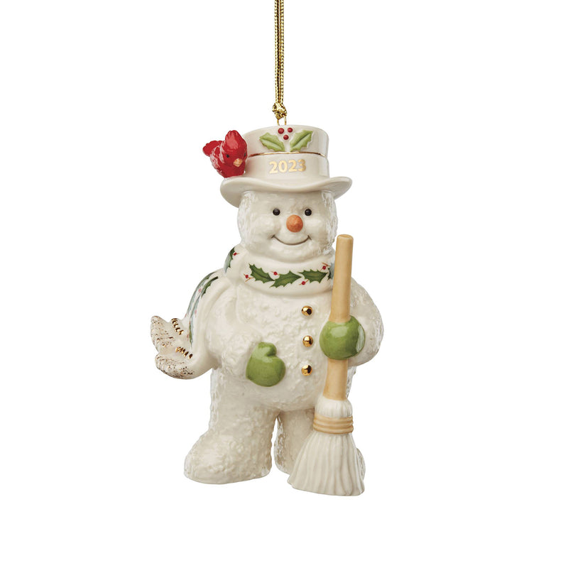 Lenox porcelain snowman ornament with broom, top hat, red scarf and 2023 badge