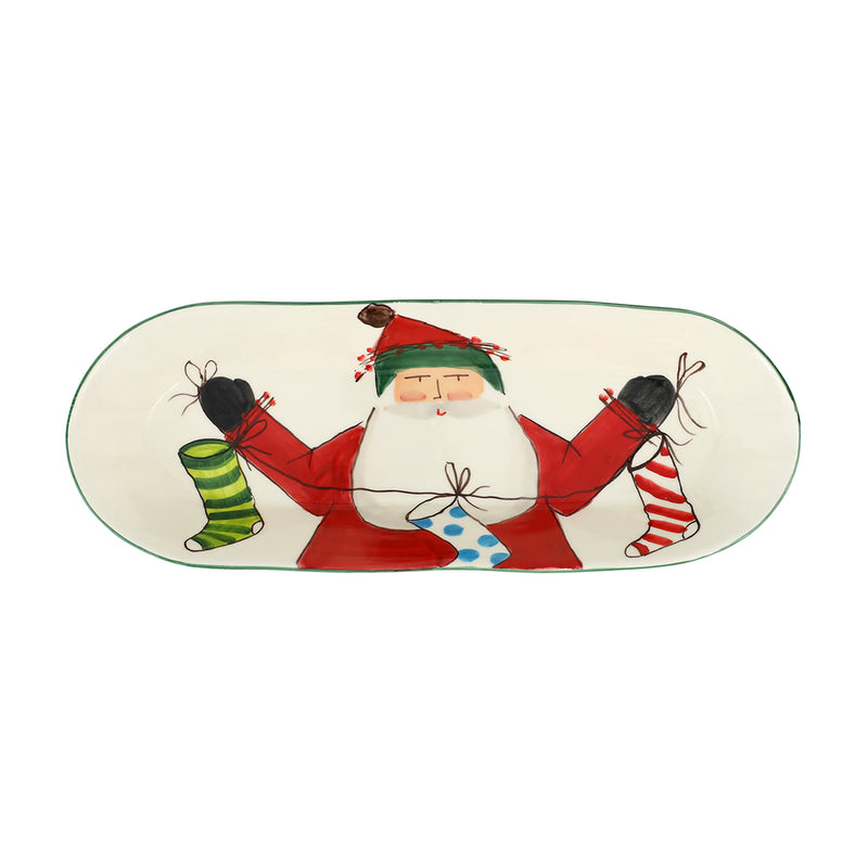 Oval ceramic bread server plate with Santa holding gifts, green trim