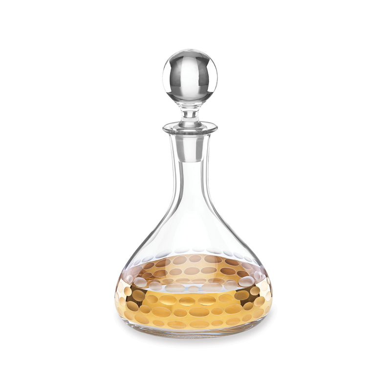 Clear glass decanter with round stopper and 24kt gold accent detail near the neck