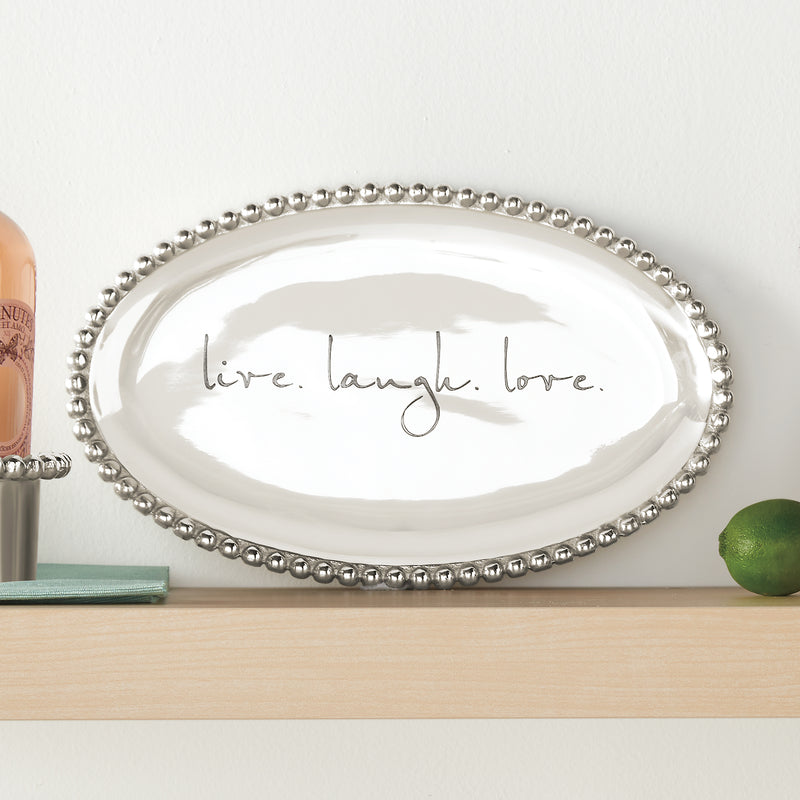 Mariposa oval serving platter with beaded pearl rim and cursive “live laugh love”