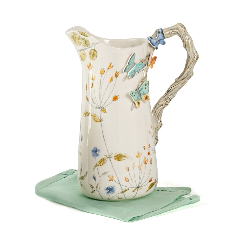 Fitz and Floyd ceramic butterfly fields pitcher with blue and orange butterfly accents
