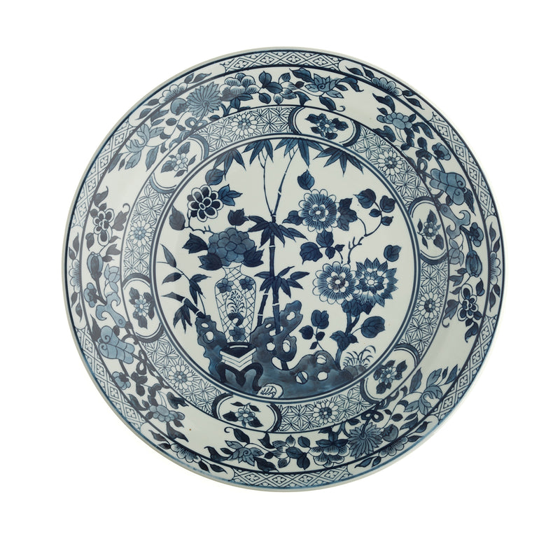 Round porcelain platter with blue-and-white lotus and floral scroll pattern, decorative rim