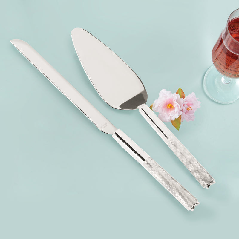 Cake knife and server set with silver blades and white ribbon-style handles