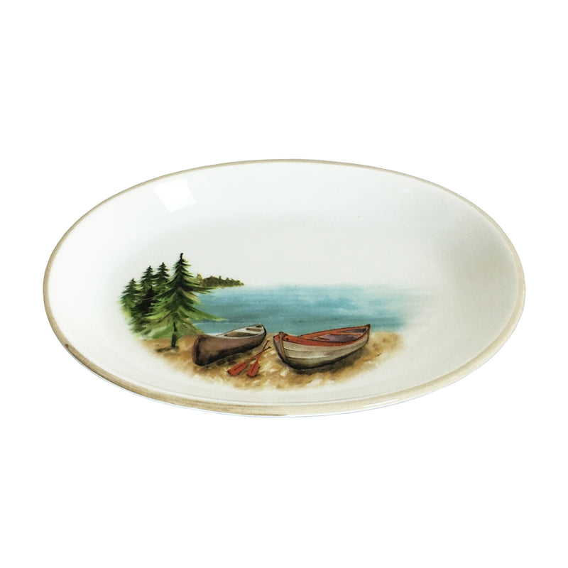 Ceramic serving bowl with lake landscape and rowboats graphic, white interior