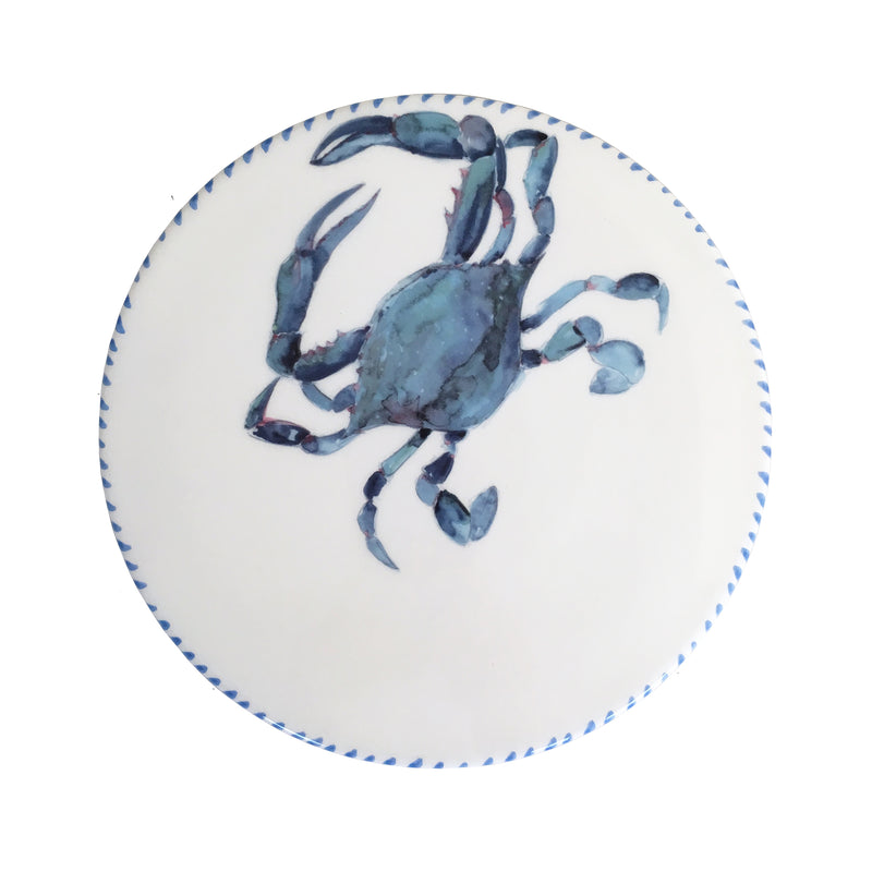 Round ceramic trivet/cheeseboard with blue crab illustration and blue border trim