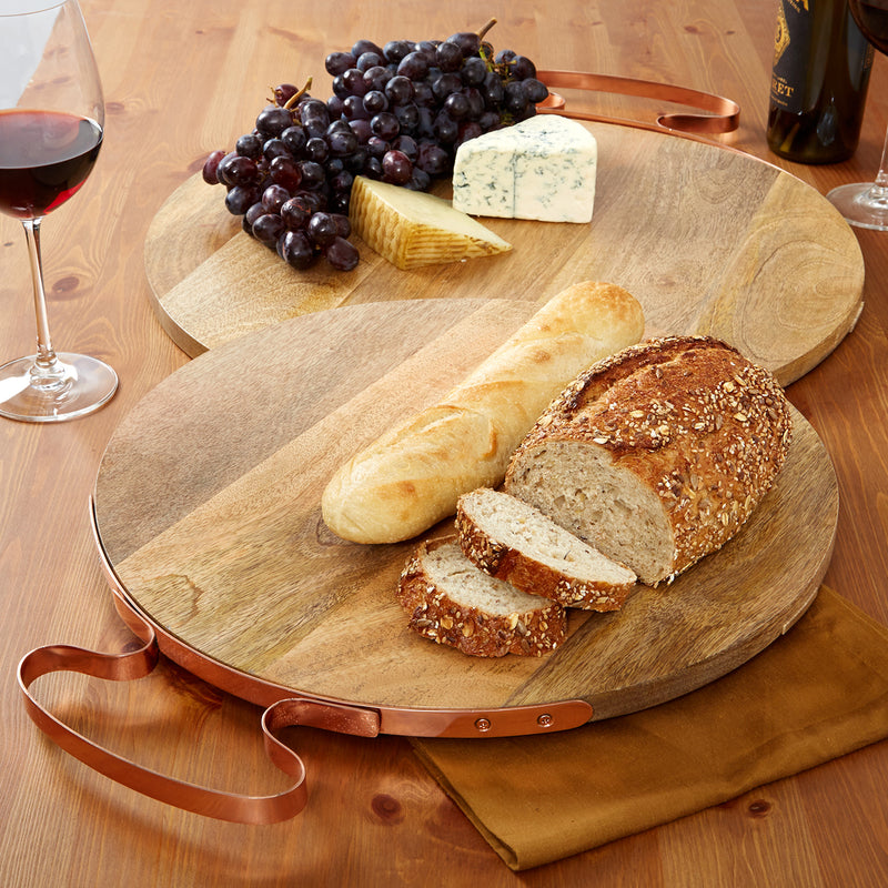 Set of 2 round wooden serving trays with copper handles