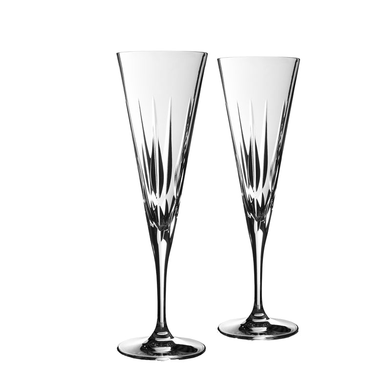 Pair of clear and dark-toned toasting flutes with faceted pattern and polished stems