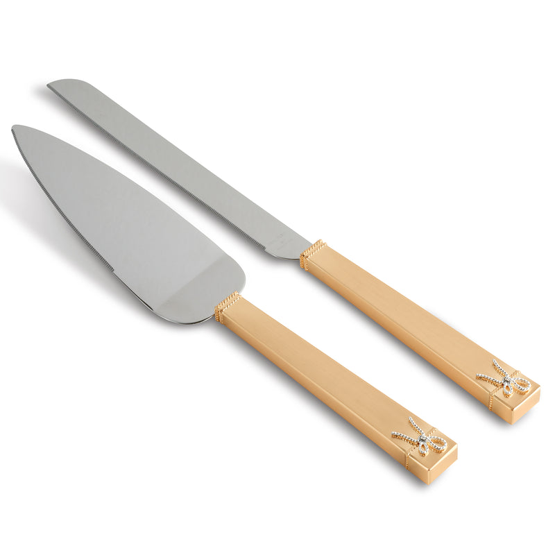 Gold cake knife and server set with engraved handles and polished silver blades