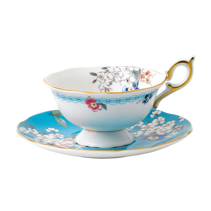 Wedgwood Wonderlust teacup and saucer set, blue floral with gold handle and rim