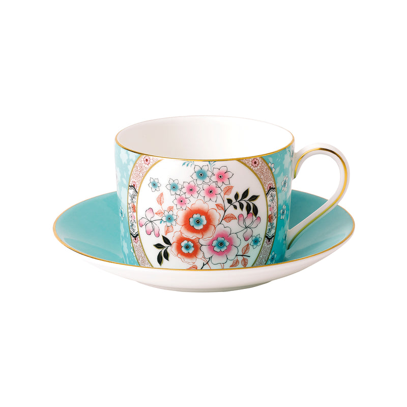 Floral teacup and saucer set with blue sides and gold rim trim