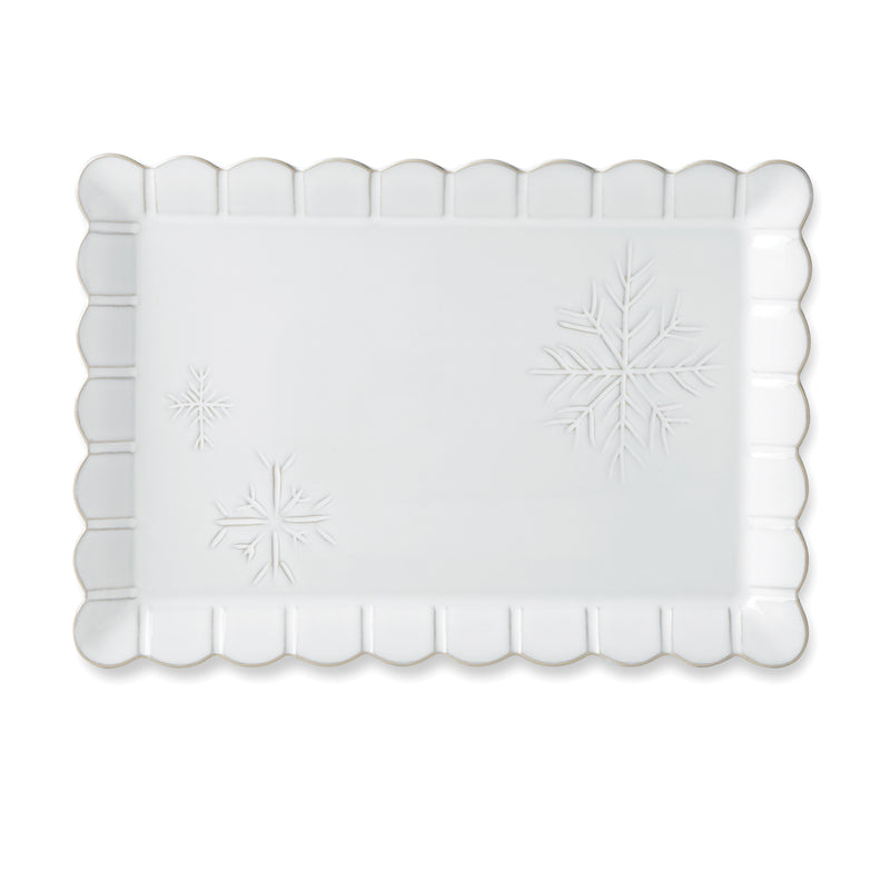 White carved rectangular serving platter with scalloped edges and snowflake motifs