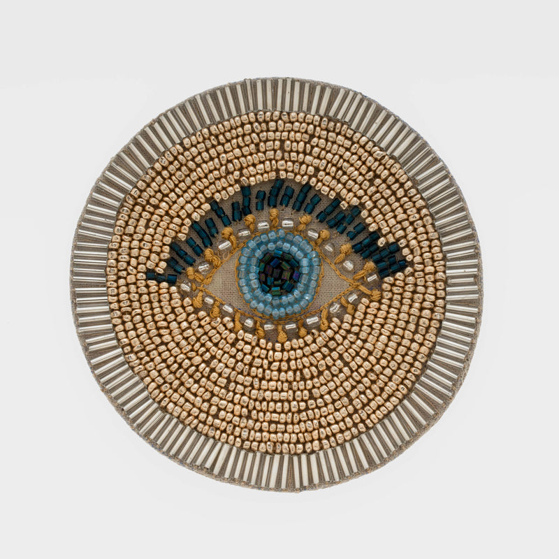 Round evil eye beaded coaster set, gold and blue bead pattern with silver rim