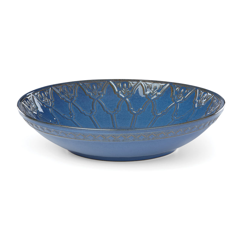 Blue porcelain low serving bowl with global tapestry pattern around rim and sides