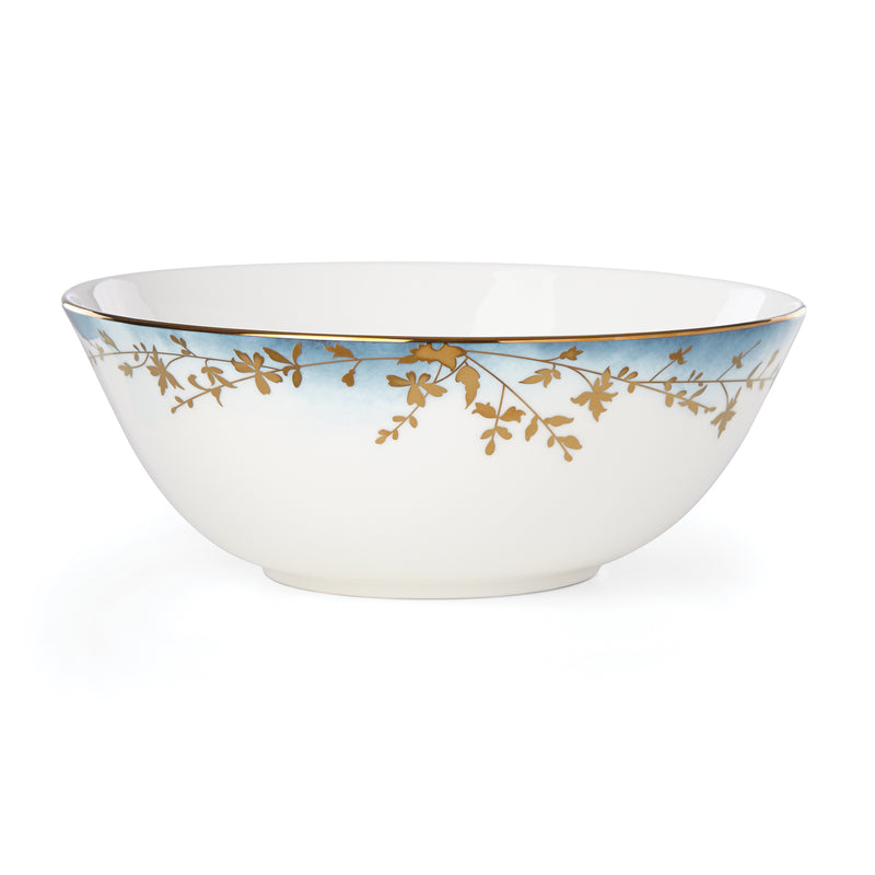 White medium serving bowl with blue rim and gold leaf branch pattern