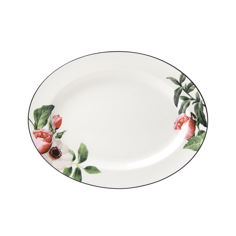 Ceramic oval serving platter with pink and green floral border and dark rim