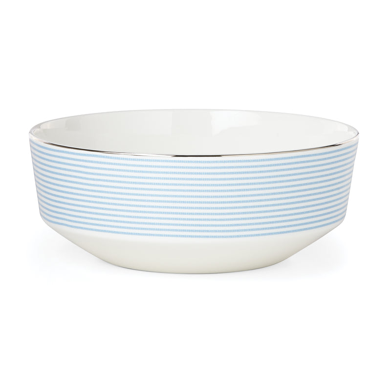 Blue-and-white striped ceramic serving bowl with glossy white interior