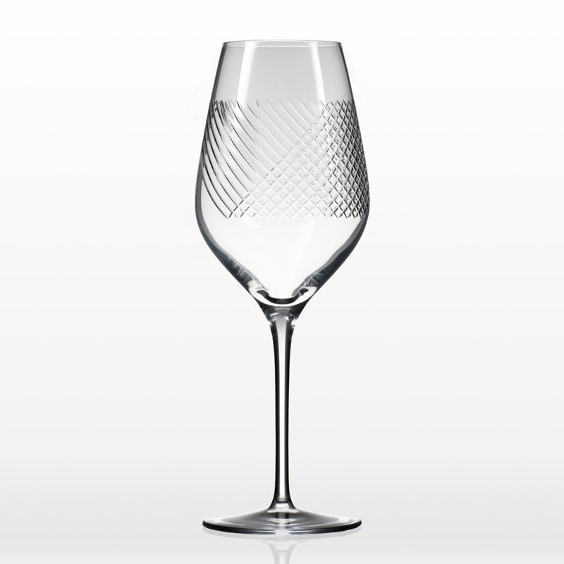 Clear white wine glass with diamond lattice pattern on bowl and tall stem
