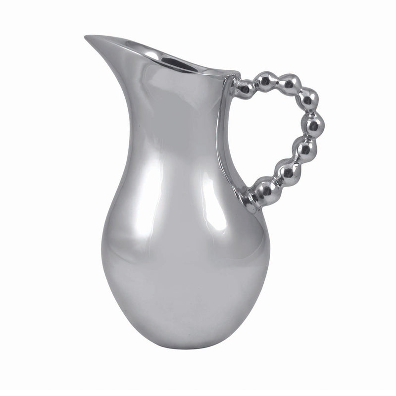 Silver-toned pearled pitcher with rounded spout and beaded handle