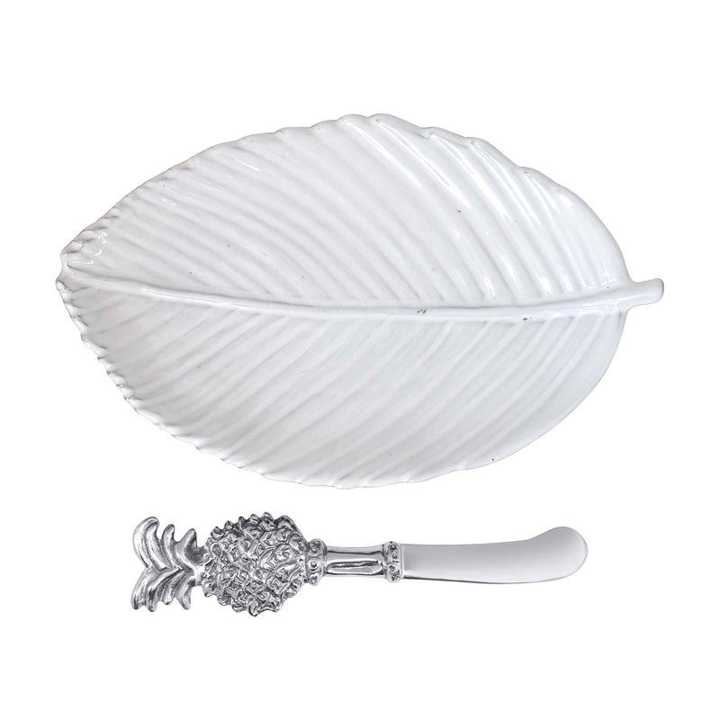 Mariposa leaf ceramic plate with pineapple spreader; white ridged dish and metal knife