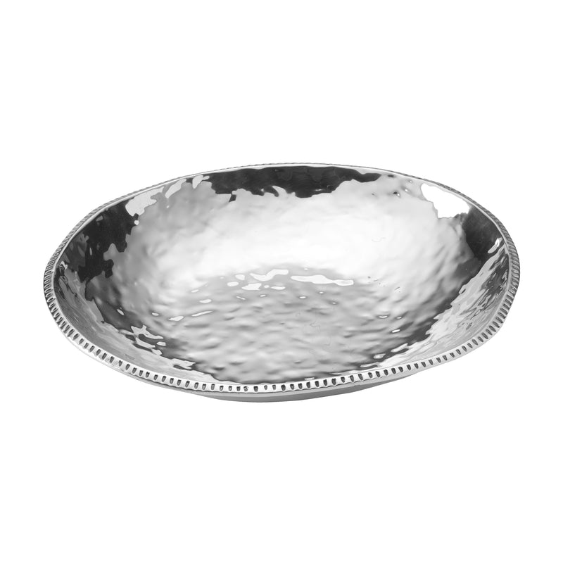 Large silver hammered metal decorative bowl with textured, scalloped rim