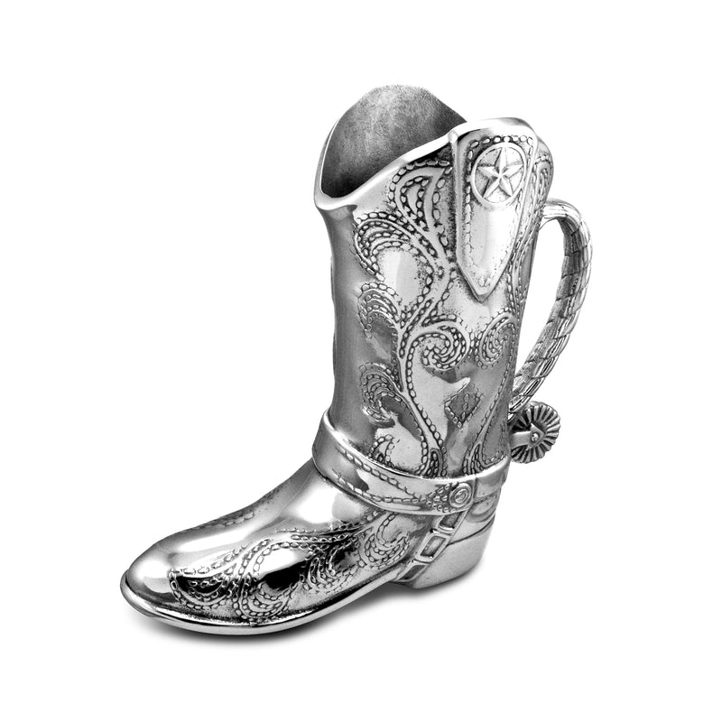 Wilton Armetale cowboy boot pitcher, silver-toned metal with ornate engraving and handle.