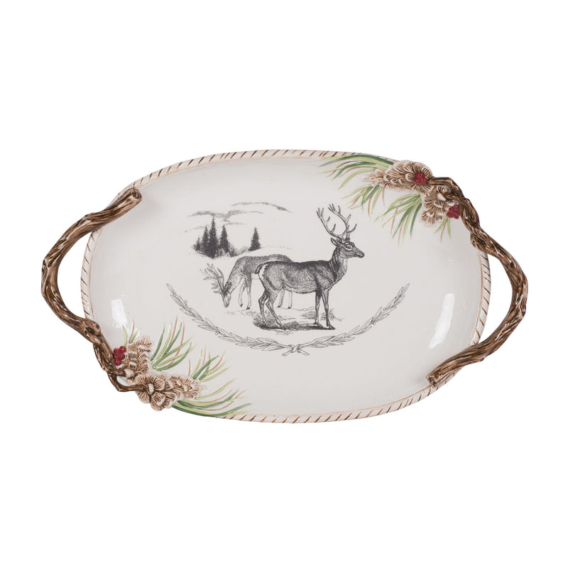 Oval ceramic centerpiece platter with handles, deer and pine forest motif, white base.