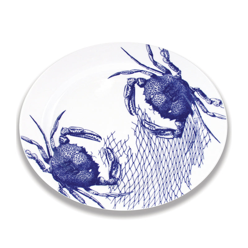 Large oval porcelain platter with blue and white crab and net design
