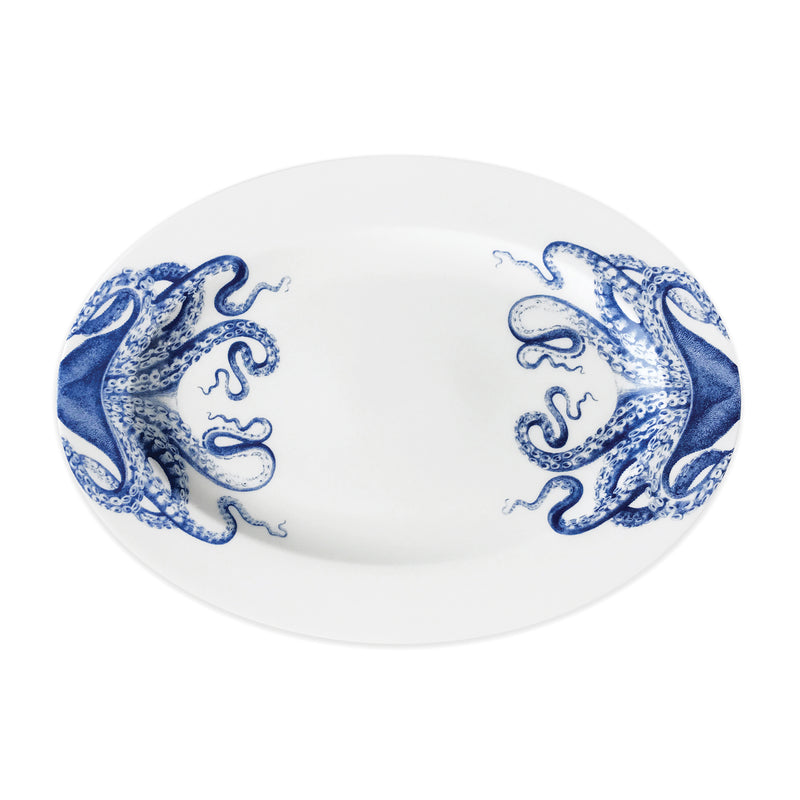 Blue and white porcelain medium oval platter with ornate scrolling pattern