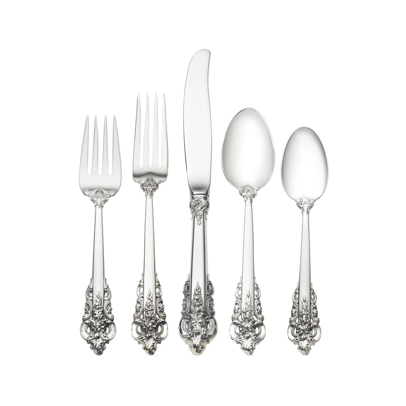 Ornate sterling silver baroque dinnerware set with forks and serving spoon