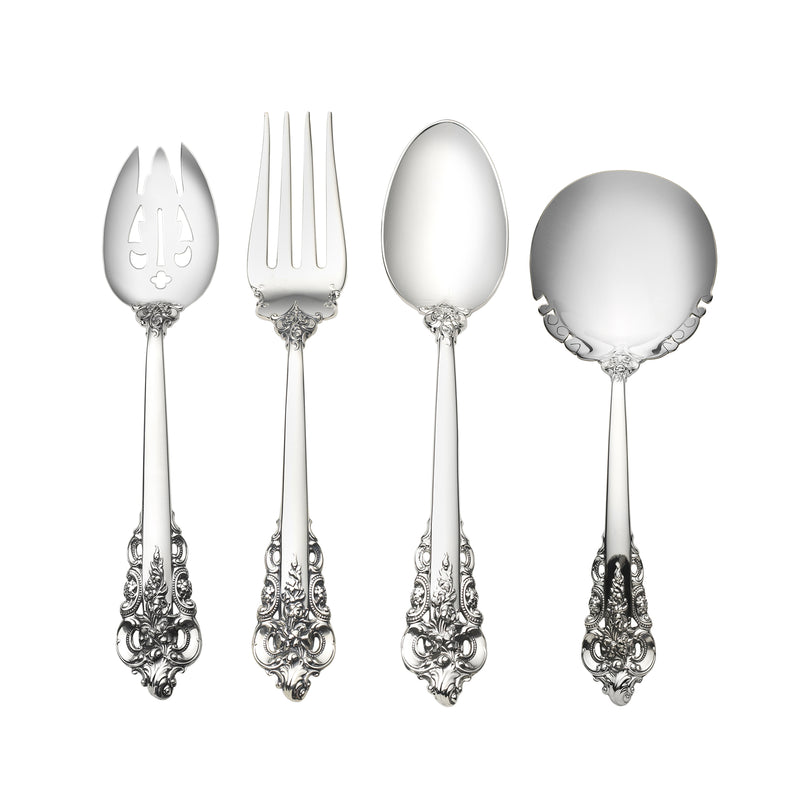 Ornate sterling silver baroque serving utensils with decorative handles and polished bowls
