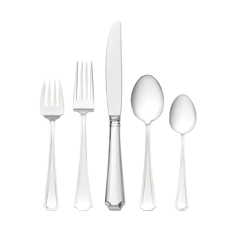 Sterling silver flatware set with polished serving utensils and dinner forks, knives